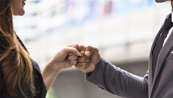 Photo illustration of CMO and chief customer officer working together