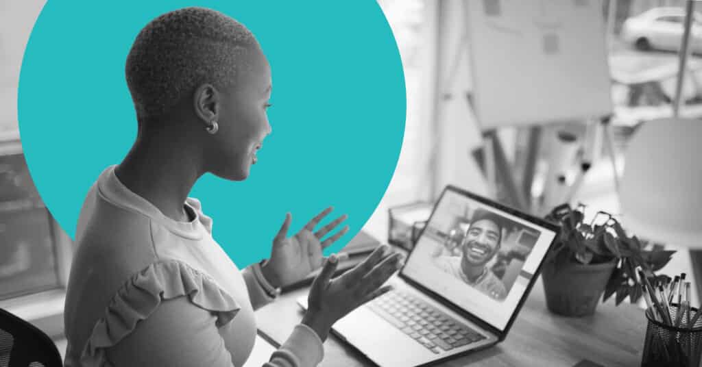 A woman at a desk engages in a video conference as part of a B2B customer loyalty program.