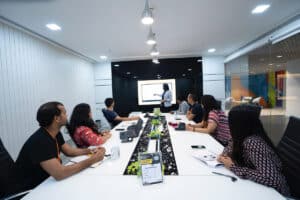 Co-workers discussing the benefits of account-based marketing in a conference room.