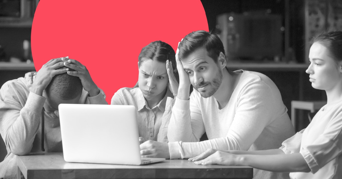 a frustrated team gathered around a laptop computer considering marketing automation migration