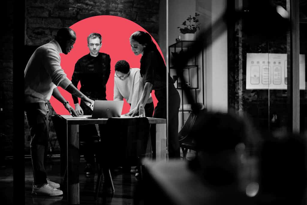 Colleagues discussing sales and marketing alignment.