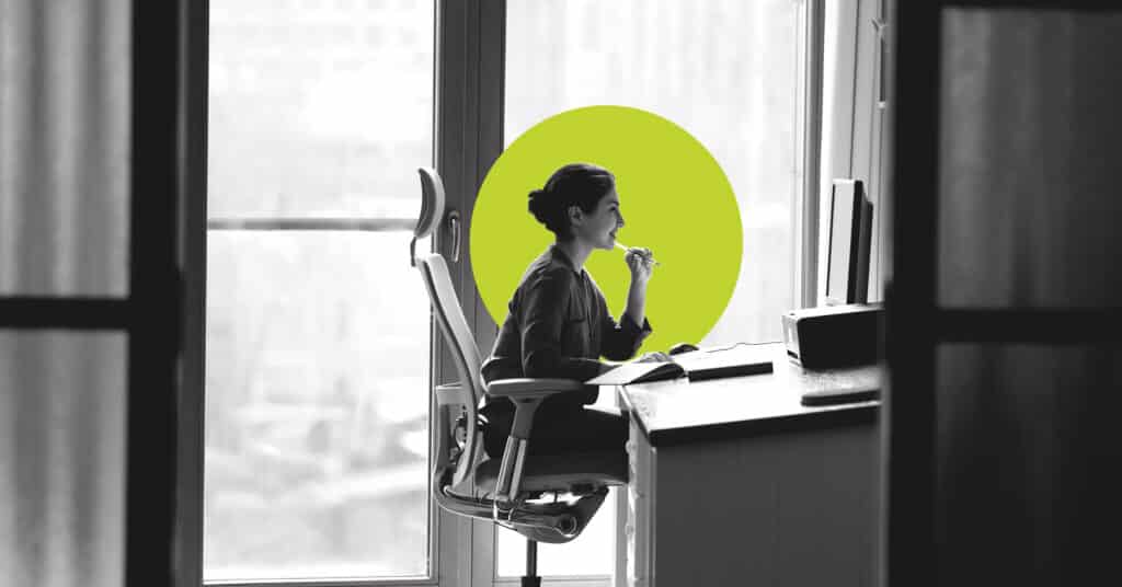 A woman crafting a new client welcome email.