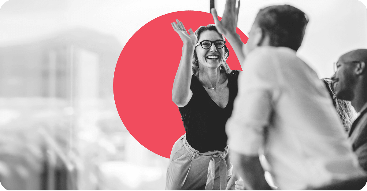 Two people giving each other a high five.