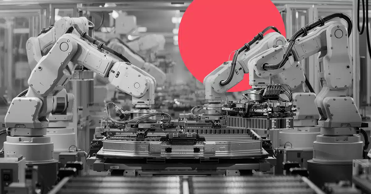 two mechanical factory robots assemble components in a manufacturing setting to represent AI automation