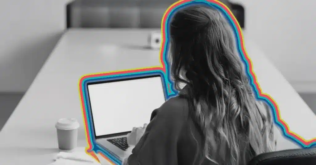 automated customer segmentation illustrated by an image of a woman looking at a laptop