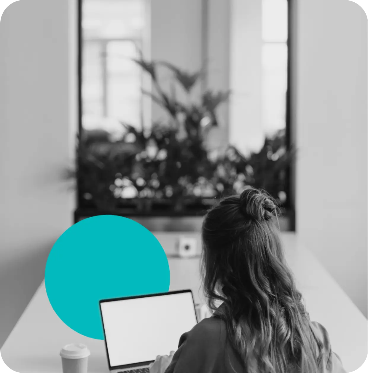 Woman working a a laptop.