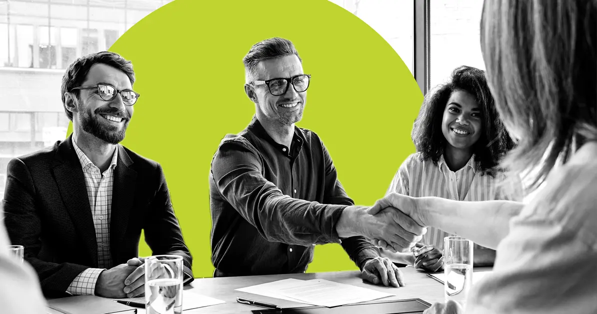 Act-On marketing automation team shaking hands with a client.